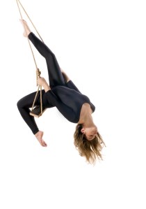 Young woman gymnast on rope